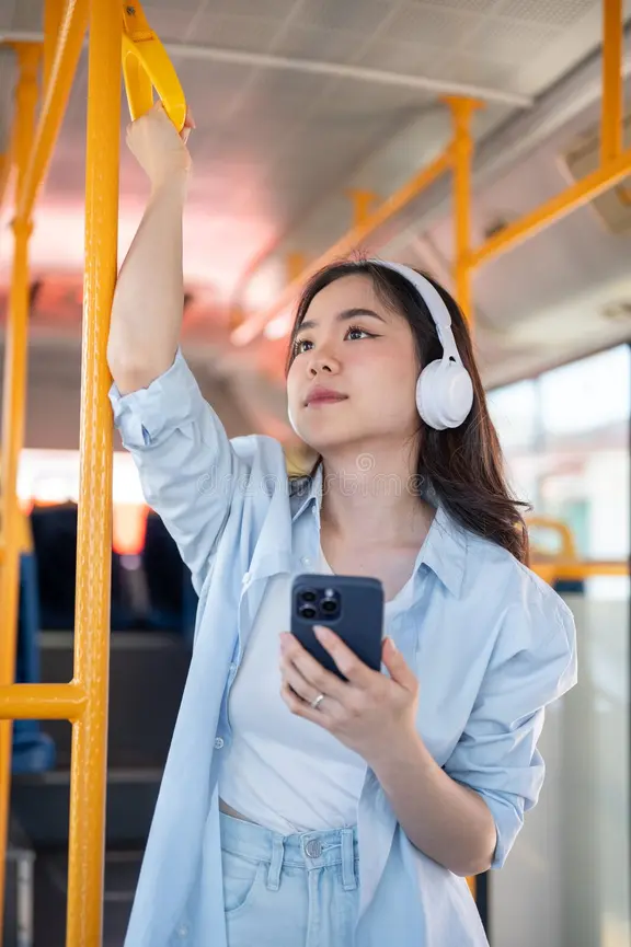 Listening to a Chinese song on headphones, riding the bus